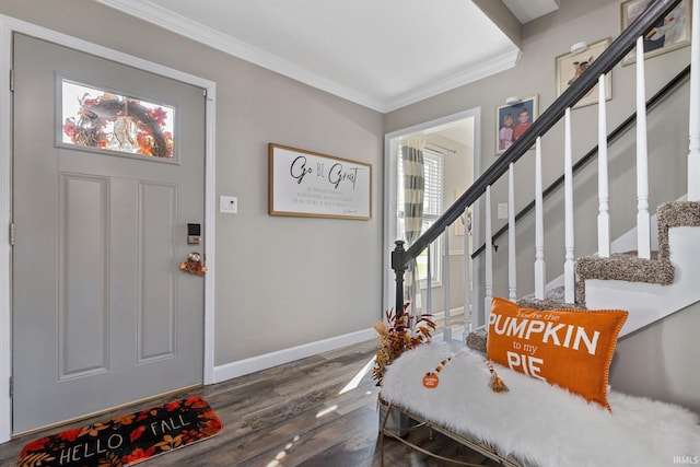 entrance foyer featuring a healthy amount of sunlight, dark hardwood / wood-style flooring, and crown molding