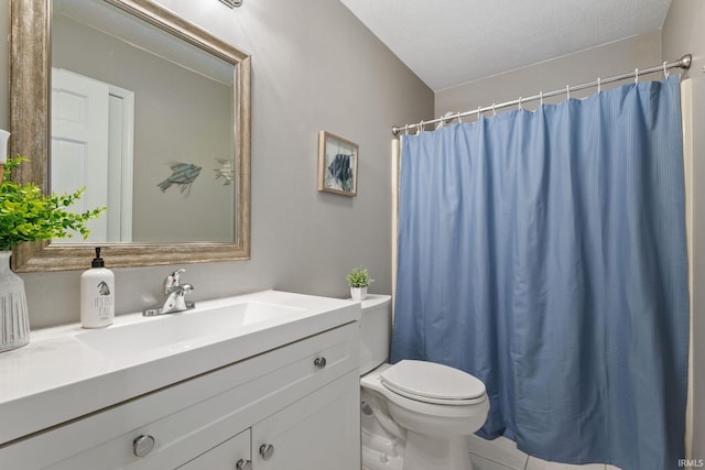 bathroom with a shower with shower curtain, vanity, toilet, and a textured ceiling