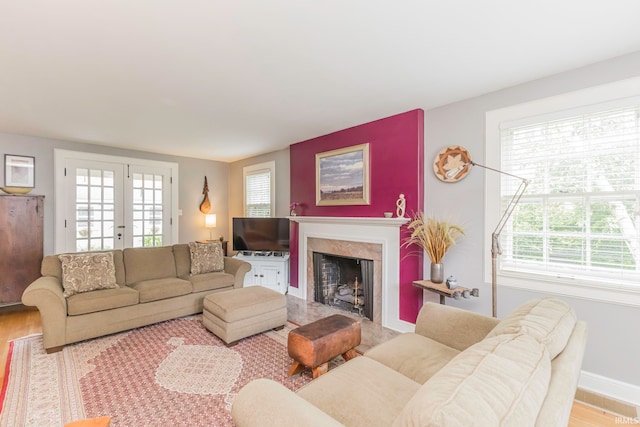 living room with plenty of natural light and hardwood / wood-style flooring