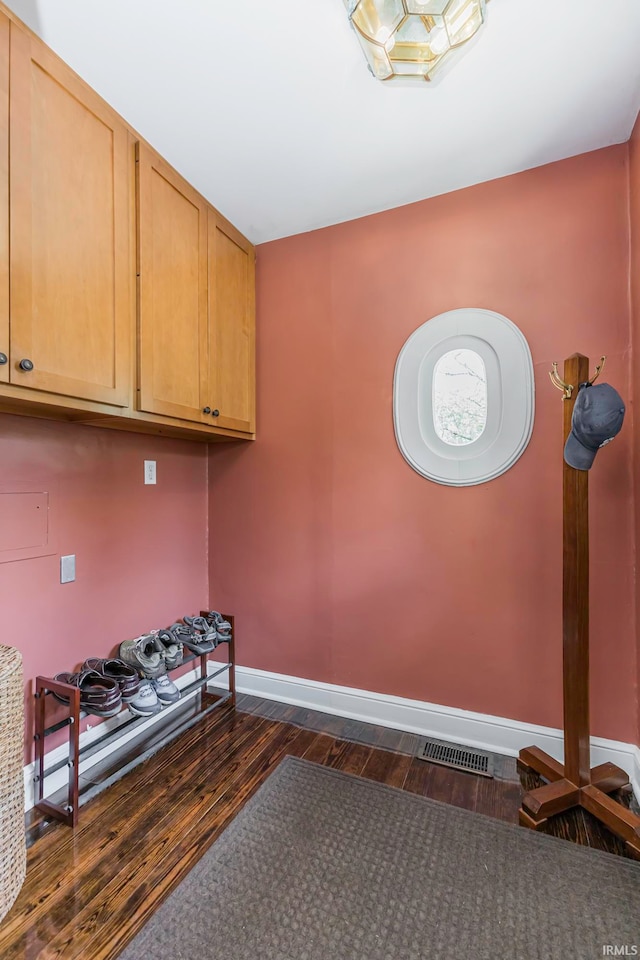 washroom with dark hardwood / wood-style floors