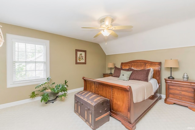 carpeted bedroom with ceiling fan and lofted ceiling