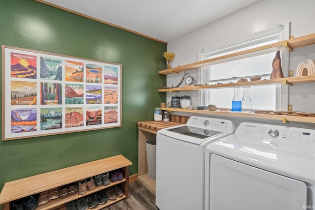 washroom featuring dark hardwood / wood-style floors and washing machine and clothes dryer