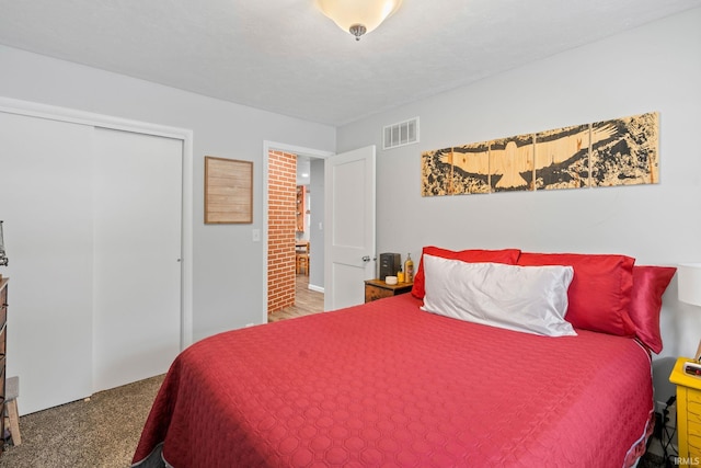 bedroom featuring carpet and a closet