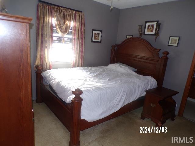 bedroom with light carpet