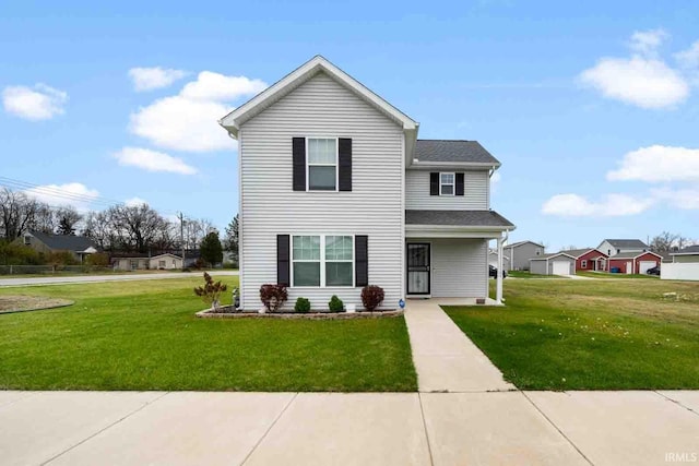 view of property featuring a front lawn