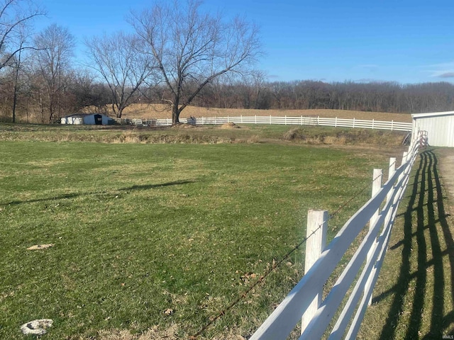 view of yard with a rural view