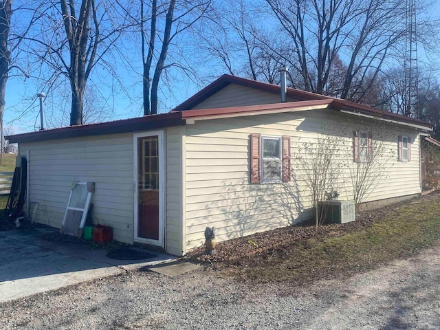 view of side of property with cooling unit