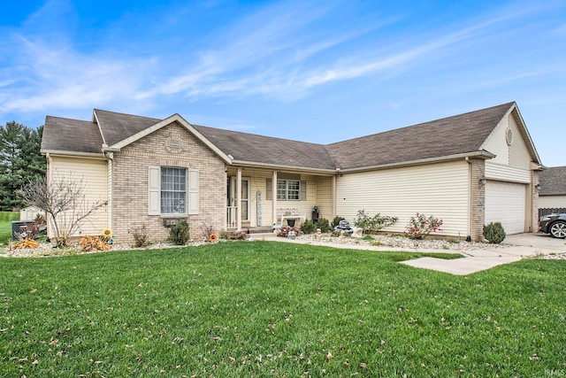 ranch-style house featuring a front lawn and a garage