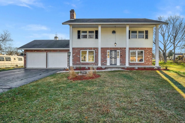 view of front of home featuring a garage and a front yard