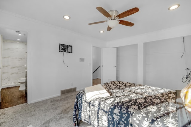 carpeted bedroom featuring ceiling fan, crown molding, and connected bathroom