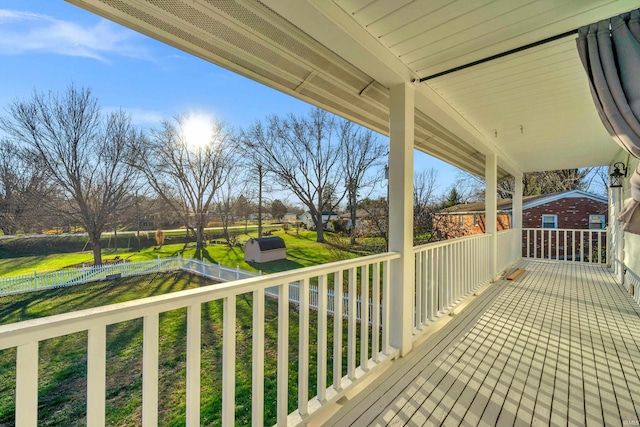 wooden deck featuring a yard