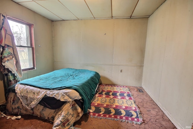 bedroom featuring carpet floors and multiple windows