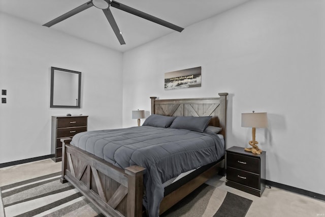 bedroom with light carpet and ceiling fan