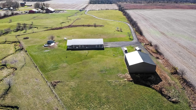 birds eye view of property with a rural view