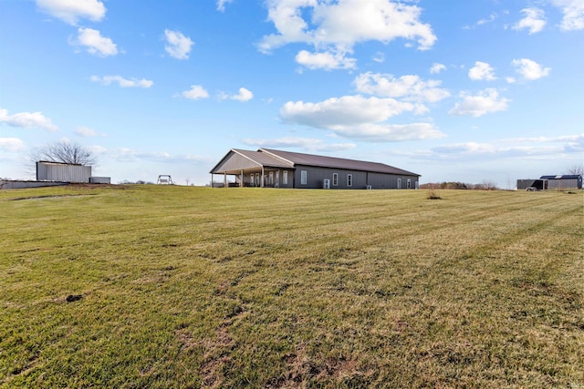 view of yard with a rural view