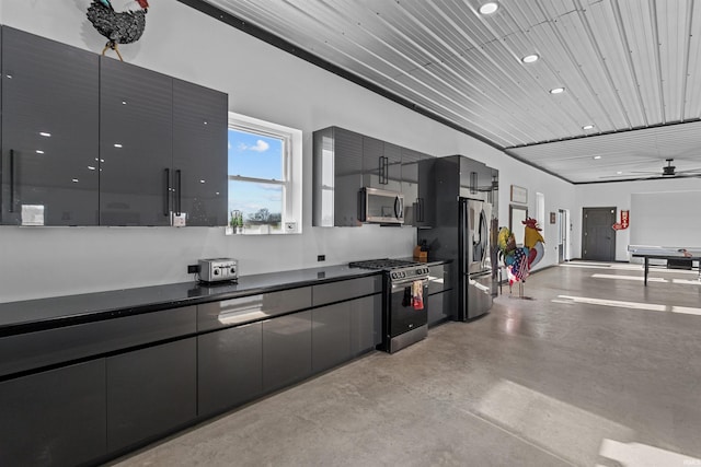 kitchen with appliances with stainless steel finishes and ceiling fan