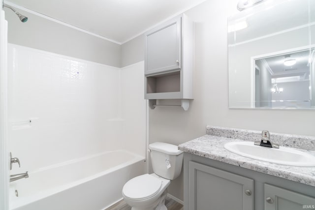 full bathroom featuring crown molding, hardwood / wood-style floors, toilet, shower / tub combination, and vanity