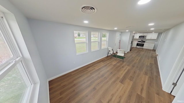 unfurnished living room with hardwood / wood-style floors