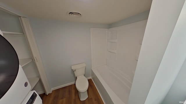 bathroom featuring hardwood / wood-style flooring and toilet