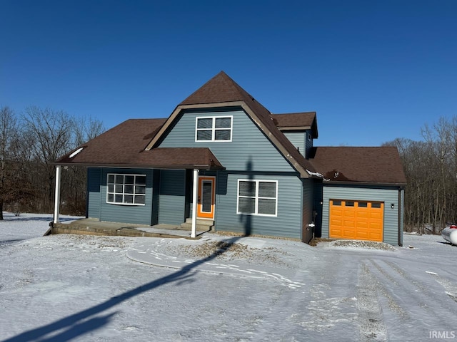 view of front of home with a porch and a garage