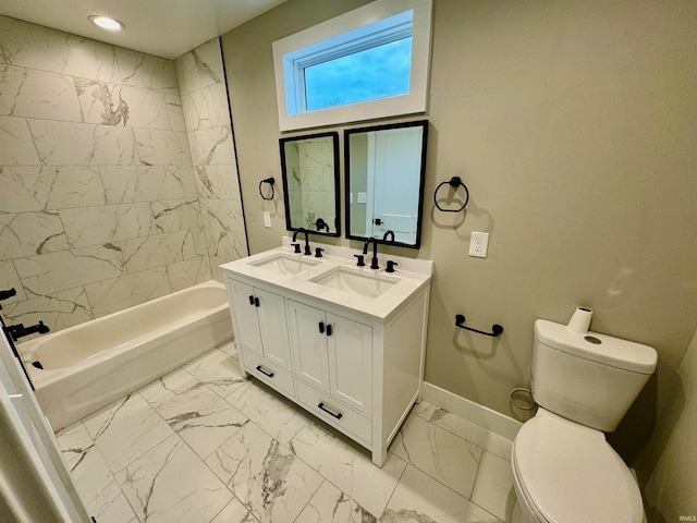 full bathroom featuring vanity, toilet, and tiled shower / bath