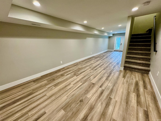 basement featuring light hardwood / wood-style flooring