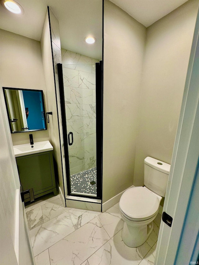 bathroom featuring vanity, toilet, and walk in shower