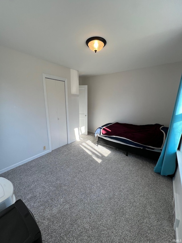 carpeted bedroom with a closet