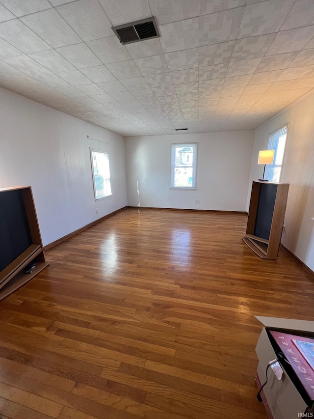 unfurnished living room featuring hardwood / wood-style floors