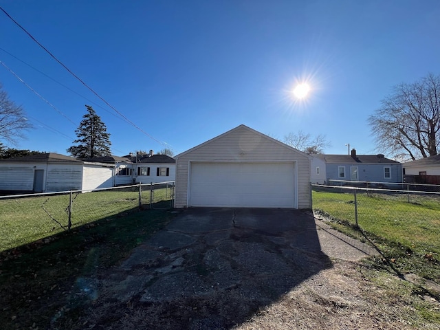 garage featuring a lawn