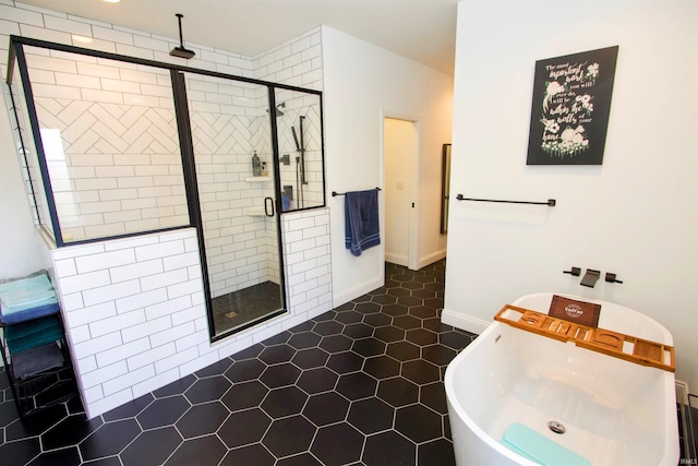 bathroom featuring tile patterned floors and a shower with shower door