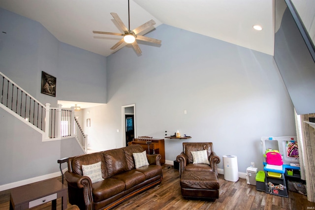 living room with ceiling fan, wood-type flooring, and high vaulted ceiling