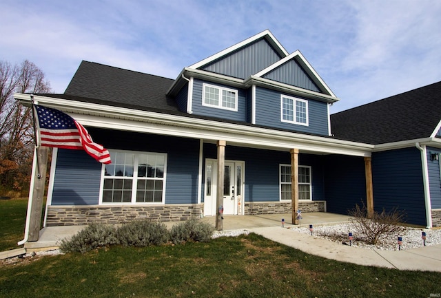 craftsman-style home featuring a front yard and a porch