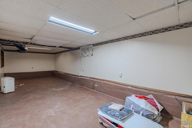 basement featuring a paneled ceiling