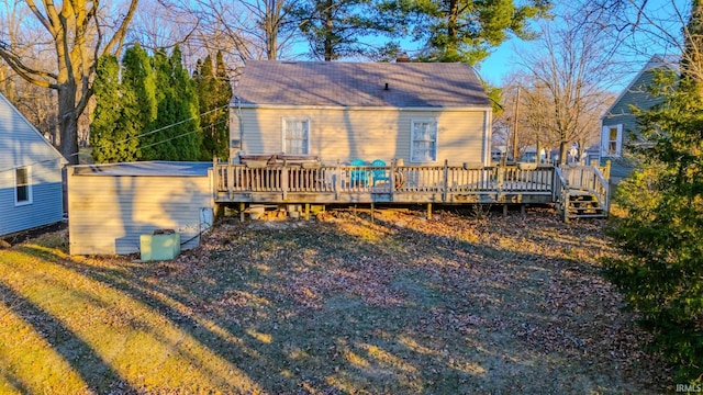 back of house with a wooden deck