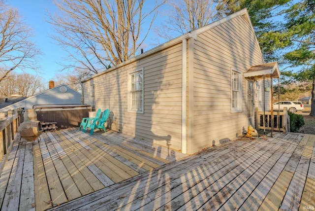 deck with a hot tub