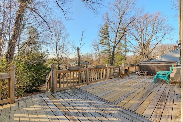 deck featuring a hot tub