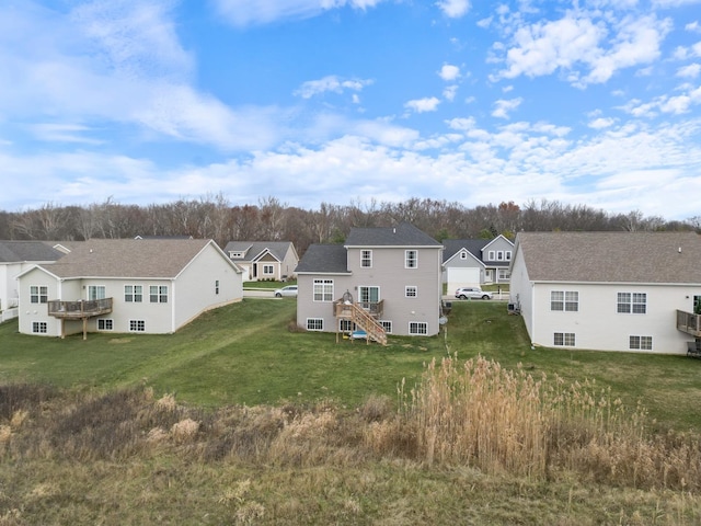 rear view of property with a yard