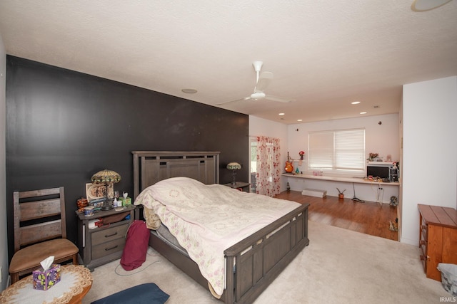 bedroom featuring light wood-type flooring and ceiling fan