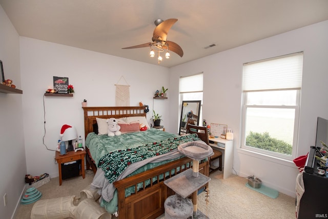 bedroom featuring ceiling fan and carpet flooring