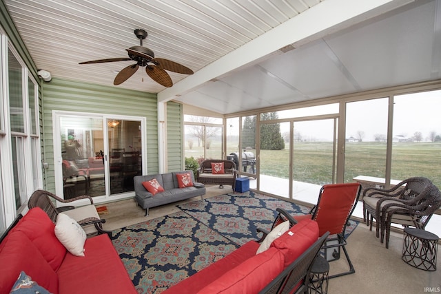 sunroom with vaulted ceiling with beams and ceiling fan