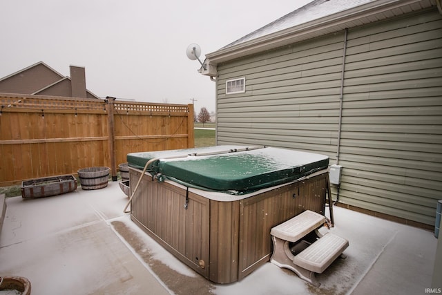 view of patio / terrace with a hot tub