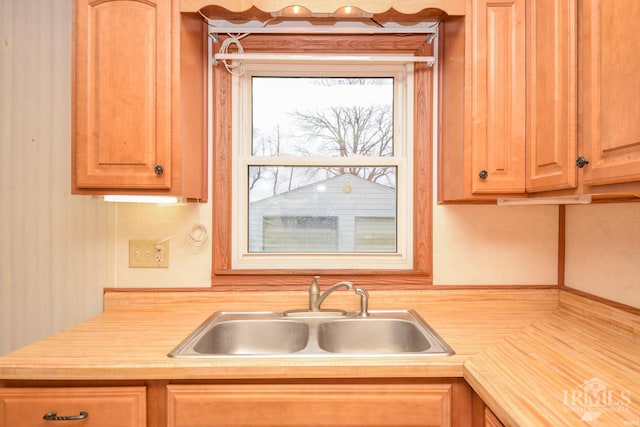 kitchen featuring backsplash and sink