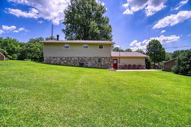 exterior space featuring central AC, a yard, and a patio