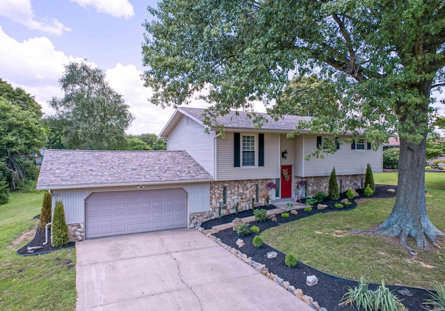 view of front facade with a front lawn and a garage