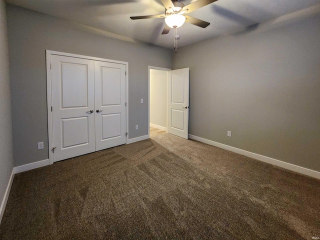 unfurnished bedroom with ceiling fan, a closet, and carpet