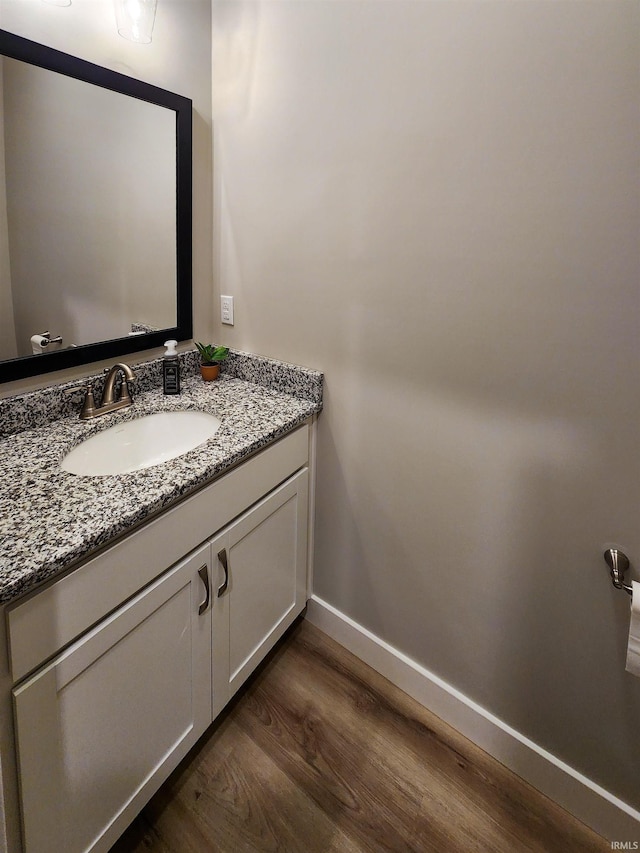 bathroom featuring vanity and wood-type flooring