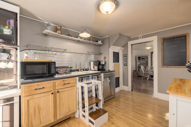 kitchen with sink, light hardwood / wood-style flooring, stainless steel dishwasher, light brown cabinetry, and butcher block countertops