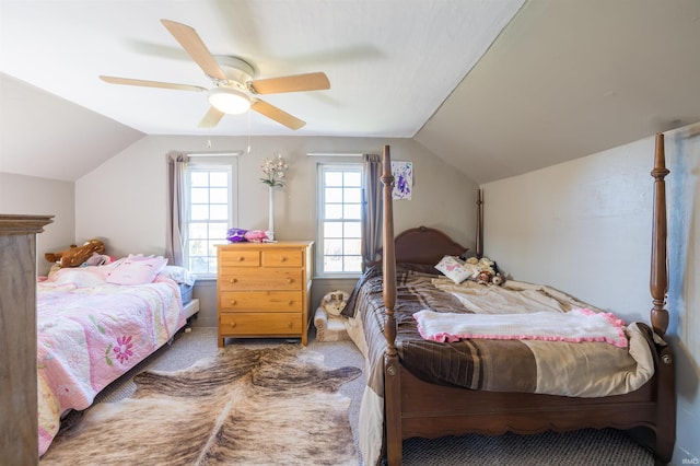 bedroom with carpet, vaulted ceiling, and ceiling fan