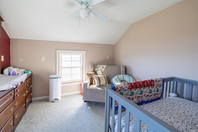 bedroom with light carpet, vaulted ceiling, and ceiling fan